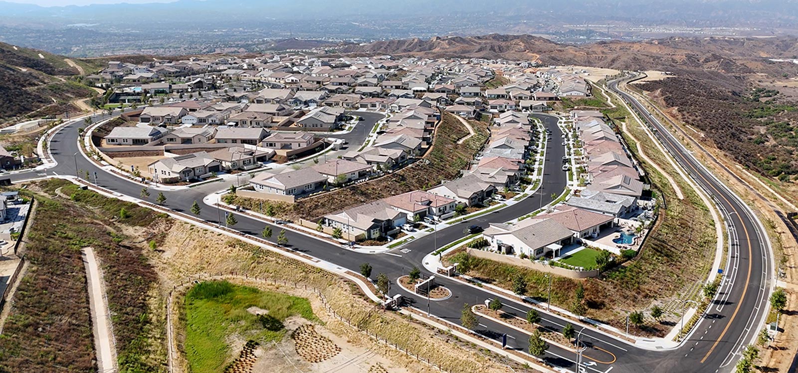 Aerial view of the Paseo 55+ neighborhood at Tesoro Highlands, Valencia, CA – completed as of early 2025