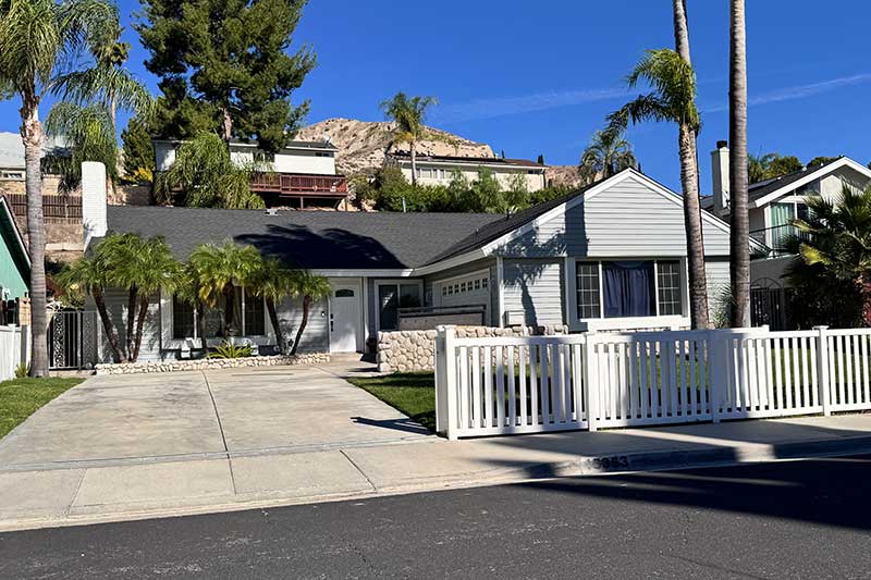 Single Story Home With Picket Fence in Pinetree Neighborhood